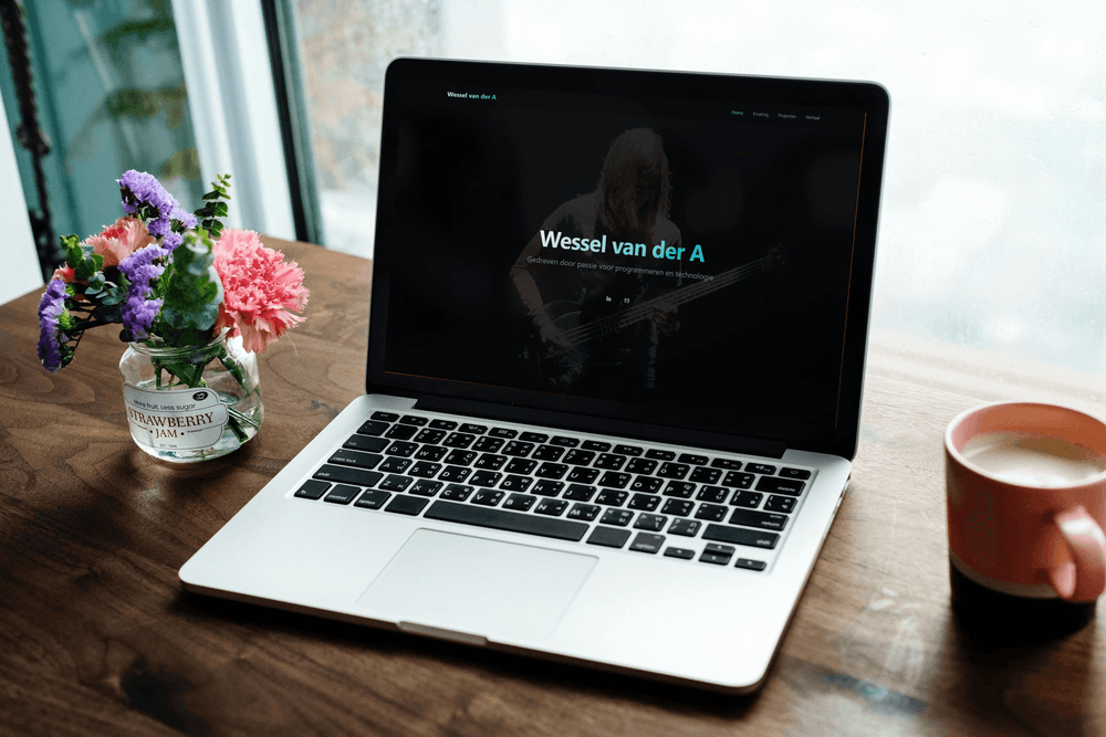 Laptop with portfolio website showing on-screen
